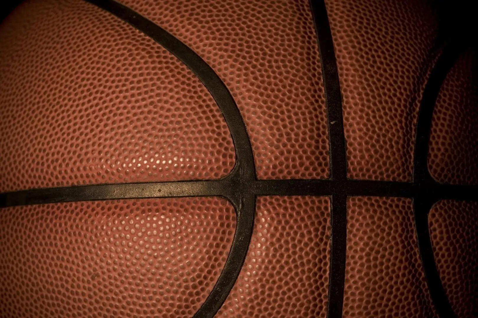 Close-up of basketball pebbled texture and seams